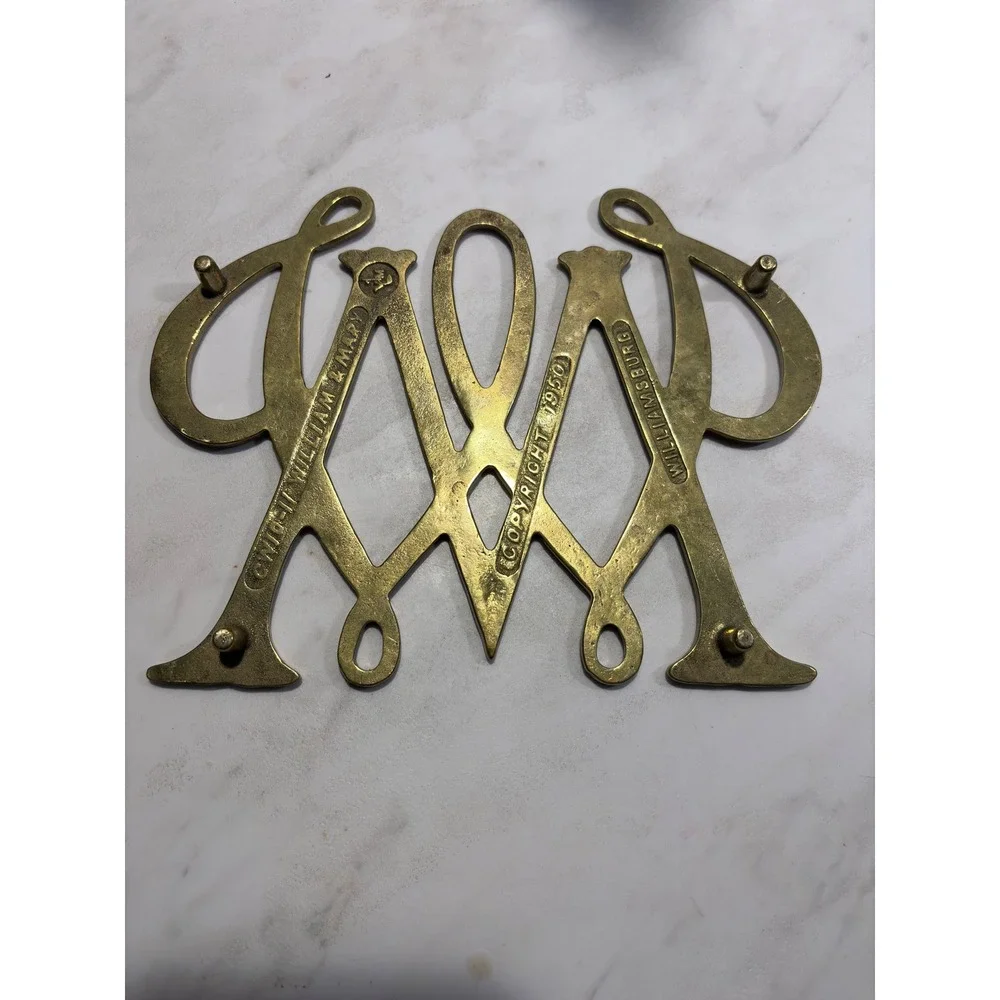 Virginia Metalcrafters Trivet OS Brass William & Mary Cypher